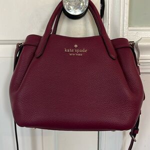 New without tags. Kate Spade crossbody bag. Wine color.